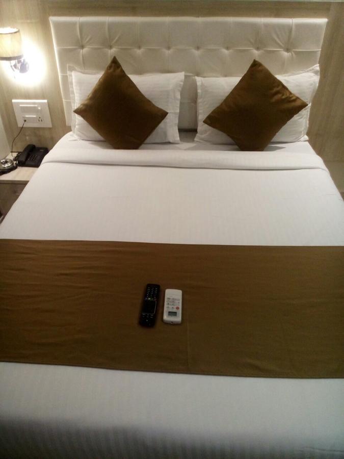 Hotel Grace Inn Bombaim Quarto foto
